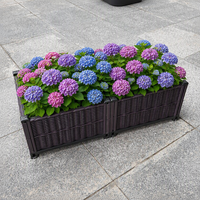 Jardinière rectangulaire en plastique imitation rotin PP, lit de jardin surélevé en osier tressé marron, léger, avec roulettes, trous de drainage et système d'arrosage automatique