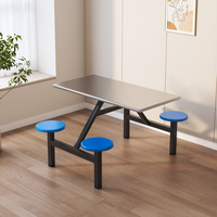 Table de cantine moderne et durable en acier inoxydable avec tabourets intégrés pour 4 personnes, idéale pour les cantines scolaires ou les messes du personnel