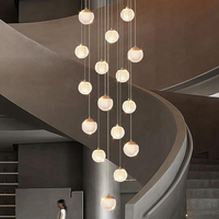 Nouveau style de lustre suspendu multi-têtes en fil métallique sphérique pour restaurant, luminaire LED créatif et personnalisé pour villa et escalier