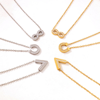 Collier ras du cou délicat pour femme en acier inoxydable de luxe plaqué or avec breloques fer à cheval infini et zircon, vente en gros