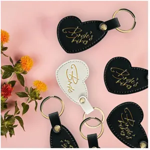 Herzförmige Geschenke für die Junggesellinabschiedsparty mit kreativem Logo aus Leder Sublimations-Schlüsselanhänger Leder für Brautpaar