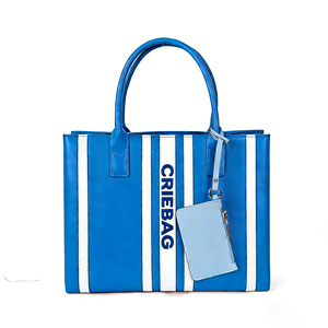 กระเป๋าถือทรงถังลายทางสำหรับผู้หญิง รุ่นใหม่ ปี 2026  โลโก้สั่งทำได้ สีน้ำเงินขาว หนัง PU กันน้ำ ความจุเยอะ สายสะพายถอดได้ สไตล์ลำลอง - Product Image 1