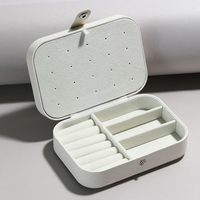 Boîte à bijoux rectangulaire multifonctionnelle en cuir PU, doublure en velours, plusieurs compartiments, crochets pour boucles d'oreilles, luxe moderne, portable