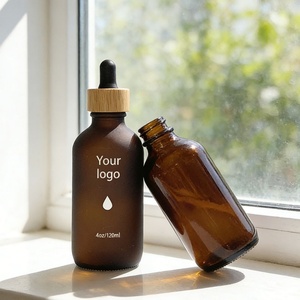 Botella de Vidrio Ámbar Esmerilado Personalizada de 120 ml, Botella Redonda Boston con Gotero, Botellas de Aceite Esencial de 4 oz con Gotero de Bambú - Product Image 1