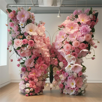 Arc de papillon de rangée de fleurs artificielles réalistes faites à la main pour décor de boutique de toile de fond de mariage caractéristique de Noël