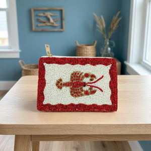 Pochette rouge perlée avec centre blanc et fermeture éclair dorée, accessoire de mode - Product Image 1