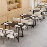 Bornes de restauration rapide modernes en PU avec sièges confortables et ensemble table-chaises en quartzite pour usage commercial dans les restaurants et cafés