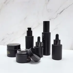 Conjunto de embalagens de cosméticos personalizadas garrafa bomba de loção frasco de creme spray garrafa de vidro preto fosco