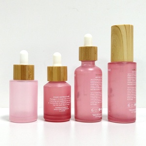 ขวดแก้วทรงแบนสีชมพูแบบกำหนดเองขนาด 1 ออนซ์ พร้อมหลอดหยด 30 มล. 50 มล. สำหรับบรรจุเซรั่มบำรุงผิวหน้า น้ำมันหอมระเหย บรรจุภัณฑ์สำหรับผลิตภัณฑ์ดูแลผิว พร้อมบริการสกรีนพิมพ์ - Product Image 4