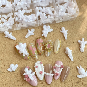 TSZS 12 grilles mignon blanc ange ongles breloques luxe mélange <span class=keywords><strong>forme</strong></span> 3D résine petit garçon ange avec aile ongles décoration - Product Image 1