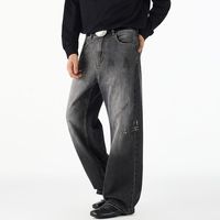 Jeans délavés tendance style américain avec motif encre rétro, coupe ample et droite, en denim