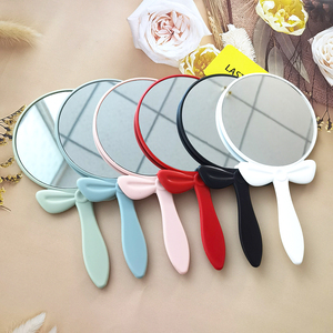 Hot Selling Handheld <strong>Makeup</strong> Mirror <strong>Simple</strong> and <strong>Cute</strong> for Girls Bow Knot Design Round Hand Mirror - Product Image 1
