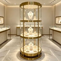 Vitrine rotative ronde en métal doré pour bijoux, présentoir en verre verrouillable à 3 niveaux avec éclairage LED pour la vente au détail de bijoux et de montres