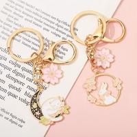 Nouveau porte-clés en métal de dessin animé bricolage mignon petit lapin fleur de cerisier frais porte-clés sac pendentif cadeau pour fille