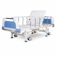 Lit d'hôpital manuel certifié CE avec freins indépendants, roulettes et barrières latérales en alliage d'aluminium pour les établissements médicaux et les soins à domicile