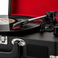 Tourne-disque vintage en forme de valise avec haut-parleurs intégrés pour salon