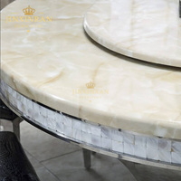 Foshan table à manger ronde en marbre à cadre en acier inoxydable de luxe moderne 4 places avec Lazy Susan