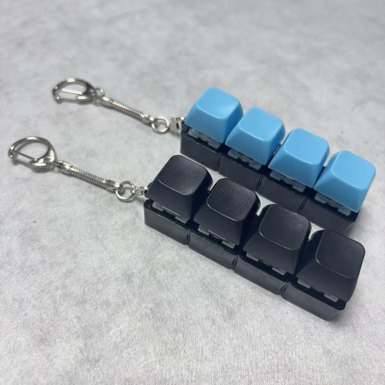 Cuatro teclas: carcasa negra, tapa negra, tapa azul 22.