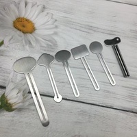 Nouveau design de distributeur de dentifrice en acier inoxydable argenté en forme de clé distributeur de dentifrice en métal tube de crème pour le visage presse-dentifrice