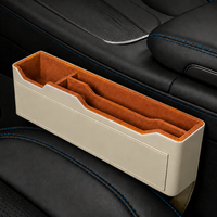 Boîte de rangement universelle personnalisable de haute qualité pour l'espace entre les sièges de voiture, en cuir PVC, pour téléphone portable et autres objets.