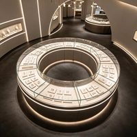Vitrine de présentation de bijoux ronde personnalisée en verre avec éclairage LED pour magasin de détail