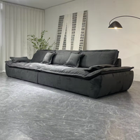 Canapé modulaire en tissu anthracite deux places en forme de L avec assise profonde, coussins d'accoudoir et dossier pour salon, villa, espace lounge contemporain