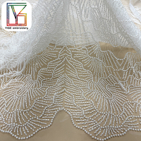 Tissu de dentelle africaine de luxe en tulle brodé de perles blanches et de sequins, lourdement perlé, pour robes de mariée