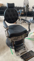 Chaise de barbier à cadre noir pistolet rond de luxe rétro adaptée aux salons haut de gamme