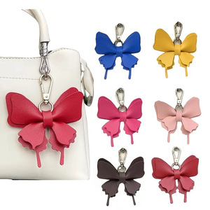 Cross-border spot PU leather bow keychain pendant ornament, fresh and colorful butterfly-shaped <b>bag</b> <b>charm</b> - Product Image 1