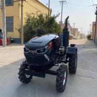 Mini-tracteur compact de 15 CV avec chargeur et pelle rétrocaveuse