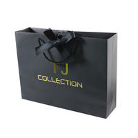 Sacs en papier d'emballage de luxe pour cadeaux, sacs de shopping en carton avec logo personnalisé, sacs de vêtements noirs pour la vente au détail, avec poignée en ruban