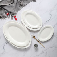 Design moderne Grande assiette ovale en céramique Blanc pur Vaisselle de restaurant Fournitures d'hôtel écologiques pour quantité minimale de commande de poisson à la vapeur 20pcs