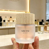 Diffuseur de parfum d'ambiance vide en verre dépoli cylindrique de 30ml, 50ml, 100ml, avec bouchon estampé à chaud, pour une fragrance longue durée et une décoration intérieure élégante.
