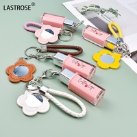 Tube de brillant à lèvres rose en gros avec miroir porte-clés brillant à lèvres liquide végétalien paillettes huile pour les lèvres maquillage longue durée marque privée