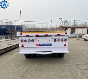 รถพ่วงพื้นเรียบ 3 เพลา ขนาด 20 ฟุต 40 ฟุต 45 ฟุต 53 ฟุต สำหรับขนส่งตู้คอนเทนเนอร์ รถพ่วงกึ่งพ่วงพื้นเรียบสำหรับขาย - Product Image 4
