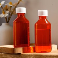 Bouteille ovale en plastique ambré anti-lumière UV personnalisée 2oz 4oz 8oz 16oz pour l'emballage de sirop, liquide oral et huile essentielle