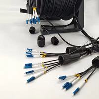 Bobine de câble à fibre optique tactique blindée rétractable portable 100M 150M pour diffusion en direct