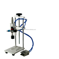 Machine de capsulage pneumatique ergonomique à commande au pied, pression 0,4-0,6 MPa, idéale pour le scellage des produits chimiques quotidiens et des sauces.