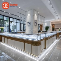Vitrine d'îlot commerciale en métal pour bijoux, présentoir de comptoir doré pour bijouterie