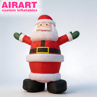 Père Noël gonflable sur pied aux bras levés, ventre proéminent, personnalisé et amusant pour les fêtes de Noël