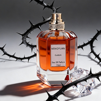 Flacon de parfum hexagonal en verre transparent de luxe 70 ml avec pompe pulvérisatrice, bouchon en acrylique sérigraphié, emballage en boîte cadeau cylindrique
