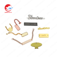 Etiquette métallique personnalisée en gros sac de vêtements accessoires de vêtement placage nom étiquettes en aluminium bande logo étiquettes de vêtements en métal