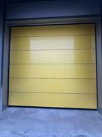 Porte sectionnelle industrielle à levage vertical robuste pour usine