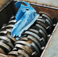 Déchiqueteuse de recyclage de pneus en plastique Prix de la machine Déchiqueteuse à double arbre de ferraille de palettes en bois et de textiles en acier