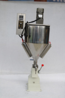 Machine de remplissage manuelle à tête unique A03 durable avec système de chauffage et agitation intégré pour liquides chimiques visqueux