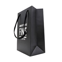 Sac en papier de luxe imprimé avec logo personnalisé en feuille d'argent pour l'emballage des vêtements