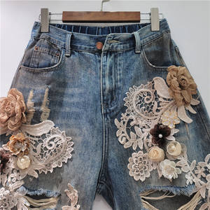 2025 femmes été et automne nouveau Niche dentelle fleur épissage brossé trou taille serrée à la mode Cool Denim Shorts - Product Image 4