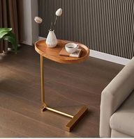 Table basse de salon minimaliste de luxe en bois durable avec cadre métallique portable et éclairage d'appoint pour canapé