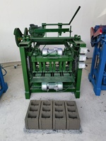 Machine de formage de blocs de béton semi-automatique à bas prix Machines de fabrication de briques de pavage à emboîtement en ciment de haute qualité