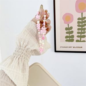 สายคล้องโทรศัพท์มือถือแบบใหม่ สีชมพูสดใส ประดับมุก สายคล้องมือถือถักมือ ใช้ได้กับโทรศัพท์มือถือทุกรุ่น พกพาสะดวก - Product Image 4